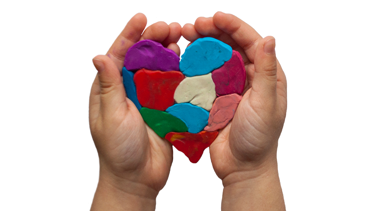 two hands holding a plasticine heart